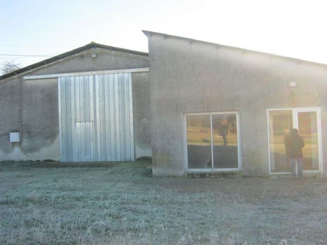 Large agricultural building with office..