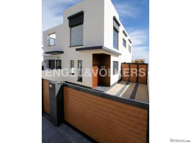 New build houses in front of a park