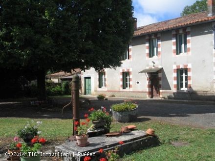 Country stone house with outbuildings