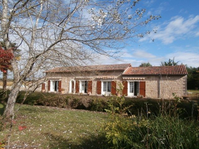 Stone house with attached garage and..