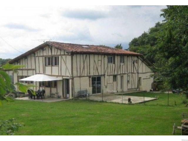 Half-Timbered House In The Countryside