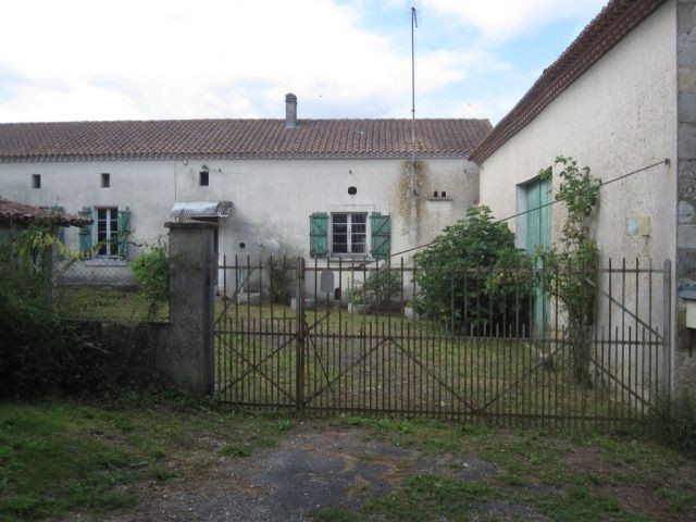 Potential! Farmhouse with its barns..
