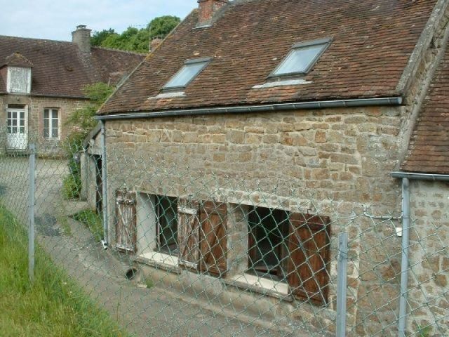 House at Edge of Village with Field