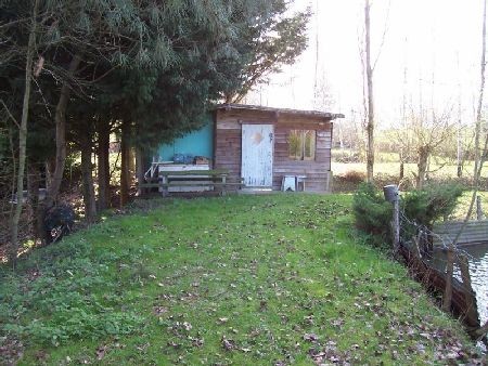 Fine fishing lake with land and small..