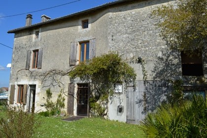 Village property with pretty garden..