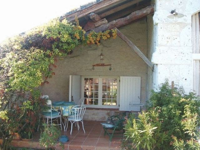 Two Stone Houses In An Elevated..