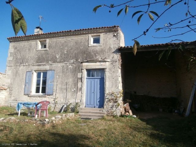 Renovated stone house with outbuildings..