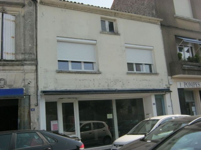 buildng with shop and apartment in..