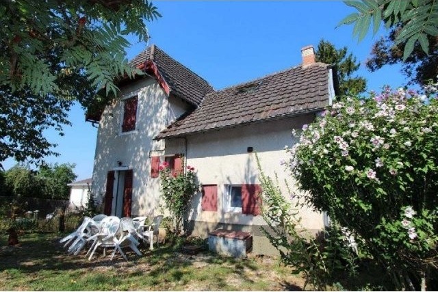 Stone House In A Village With Shops