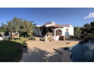 This villa with private pool is surrounded by pine trees..