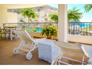 This two-bedroom apartment with lovely sea views and a..