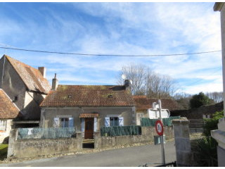 Village house with garden and garages.