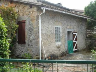 Old Stone House And A Barn In A..