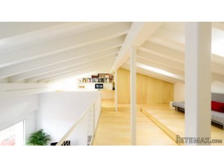 This duplex apartment, located in the heart..
