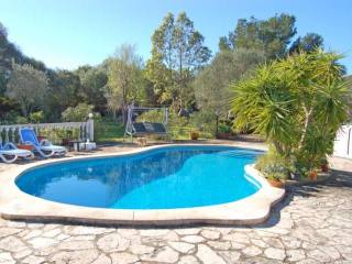 Country house with pool in a green..