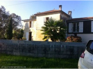 Restored stone house with view over the..