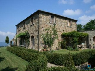 Traditional Tuscan farmhouse with lake