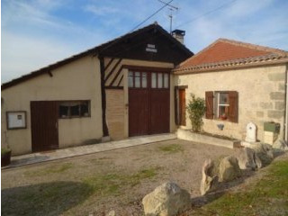 Pretty Stone And Half-Timbered House..