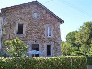 Stone House On The Edge Of A Small Town
