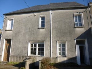 Village House with Lots of Potential