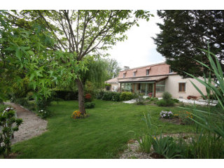 Pretty stone house with attached barn..
