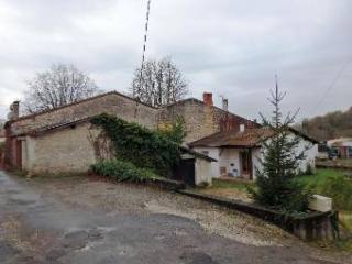A Small Stone House Situated In An..