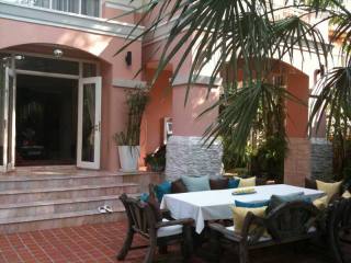 House with garden in the center of..