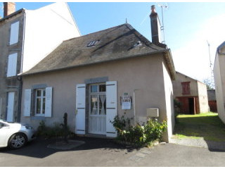 Cottage on village square with an acre.