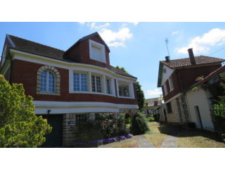 Two houses with big riverside garden..