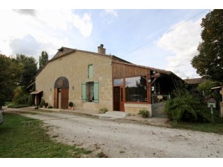 Stone farmhouse with attached barn and..