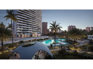 Una imponente torre de vidrio de apartamentos con..