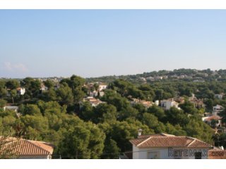 Sloping building plot with open views in a green..