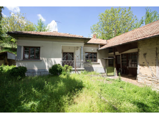 House with big stone-built barn near..