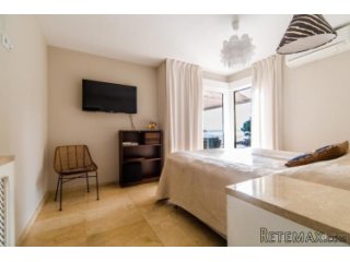 Seafront apartment in Cas Catala with an expansive private..