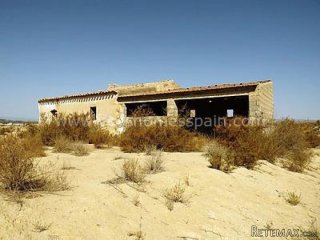 Large plot of land of 9000m2 mainly flat land with tarmac..