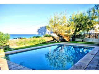 First line modern house in Cala San Vicente with amazing..