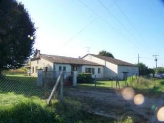 A Large Old Farmhouse With Outbuildings..