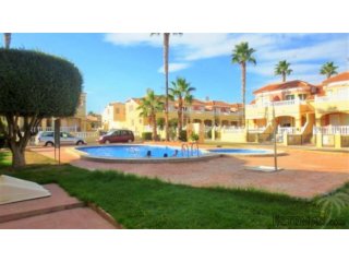 This bungalow is located in a green area with three..