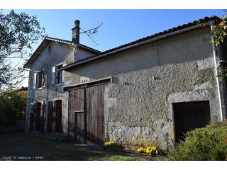 Stone house situated in a village with..