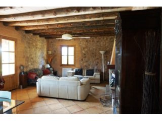 The house is situated on a private road, next to a forested..