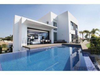 This modern villa with views to the sea, mountains and..