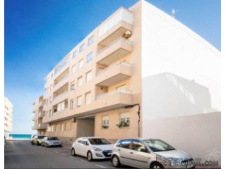 This cozy apartment can be found a few steps from the beach..