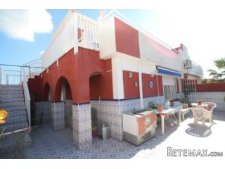 This semi-detached house is located next to the commercial..