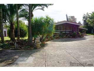 Hidden away between the beautiful plants and trees, this..