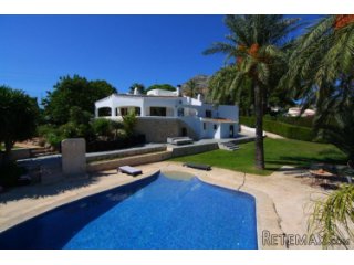 This impressive Ibiza style villa is located within walking..