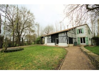 Riverside property with main house and..