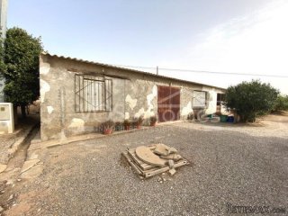 RUSTIC LAND for sale which has a large 400m2 work shop..