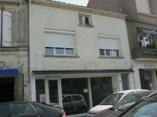 buildng with shop and apartment in..