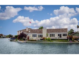 Stunning wide waterfront single level..