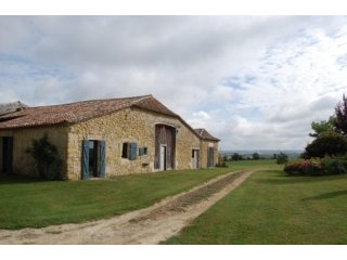 APS2220 A large stone farmhouse with an..